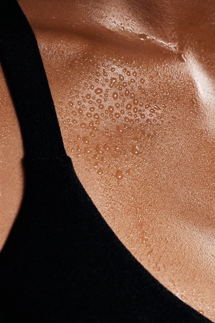 Macro detail of skin and perspiration, the physical heat of the room