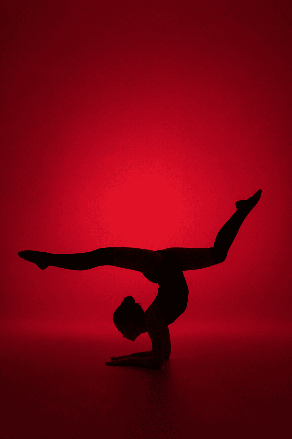 Red-lit scorpion pose silhouette, bold editorial black and red