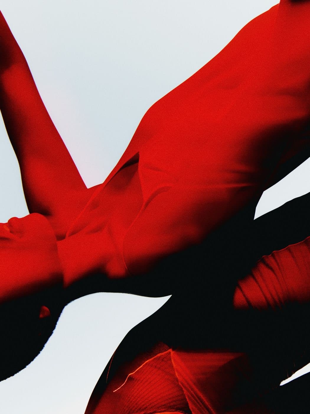 Fragment of red fabric and shadow, editorial crop